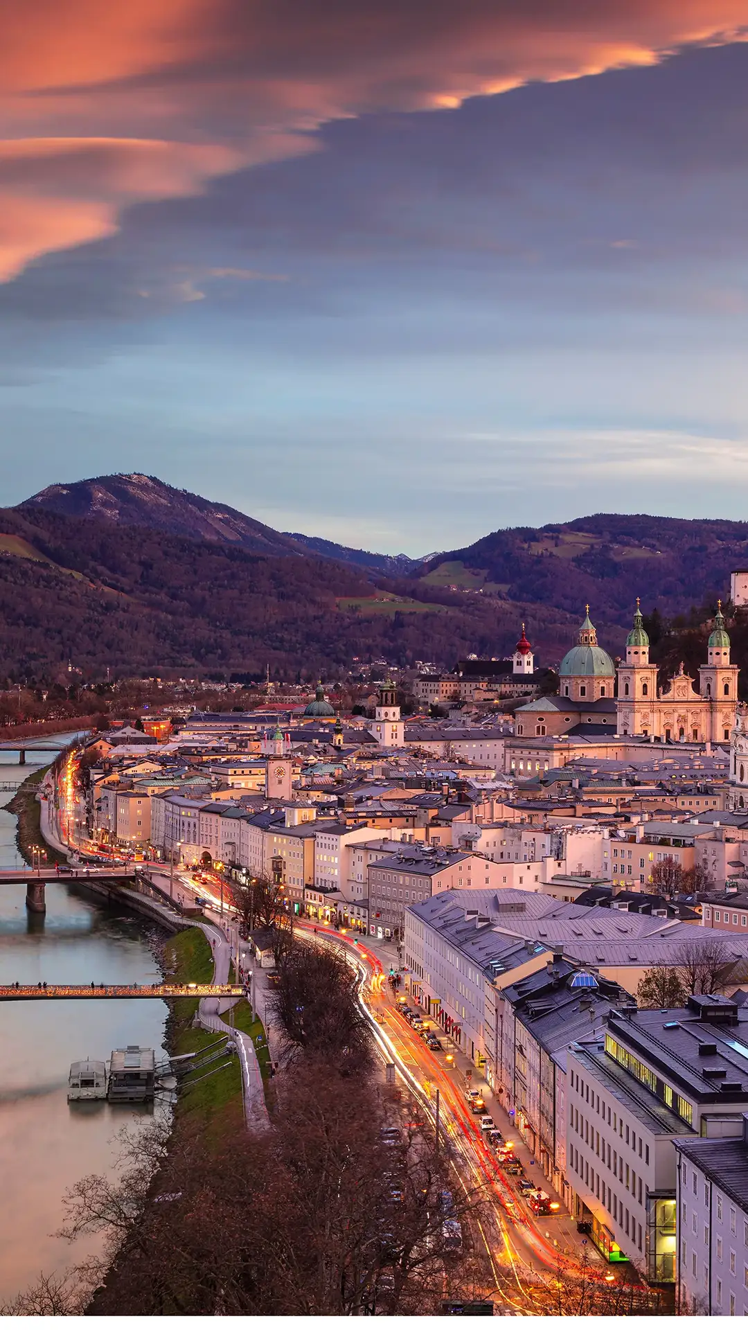 Image of Salzburg, Austria with Salzburg Cathedral during beautiful winter sunset.