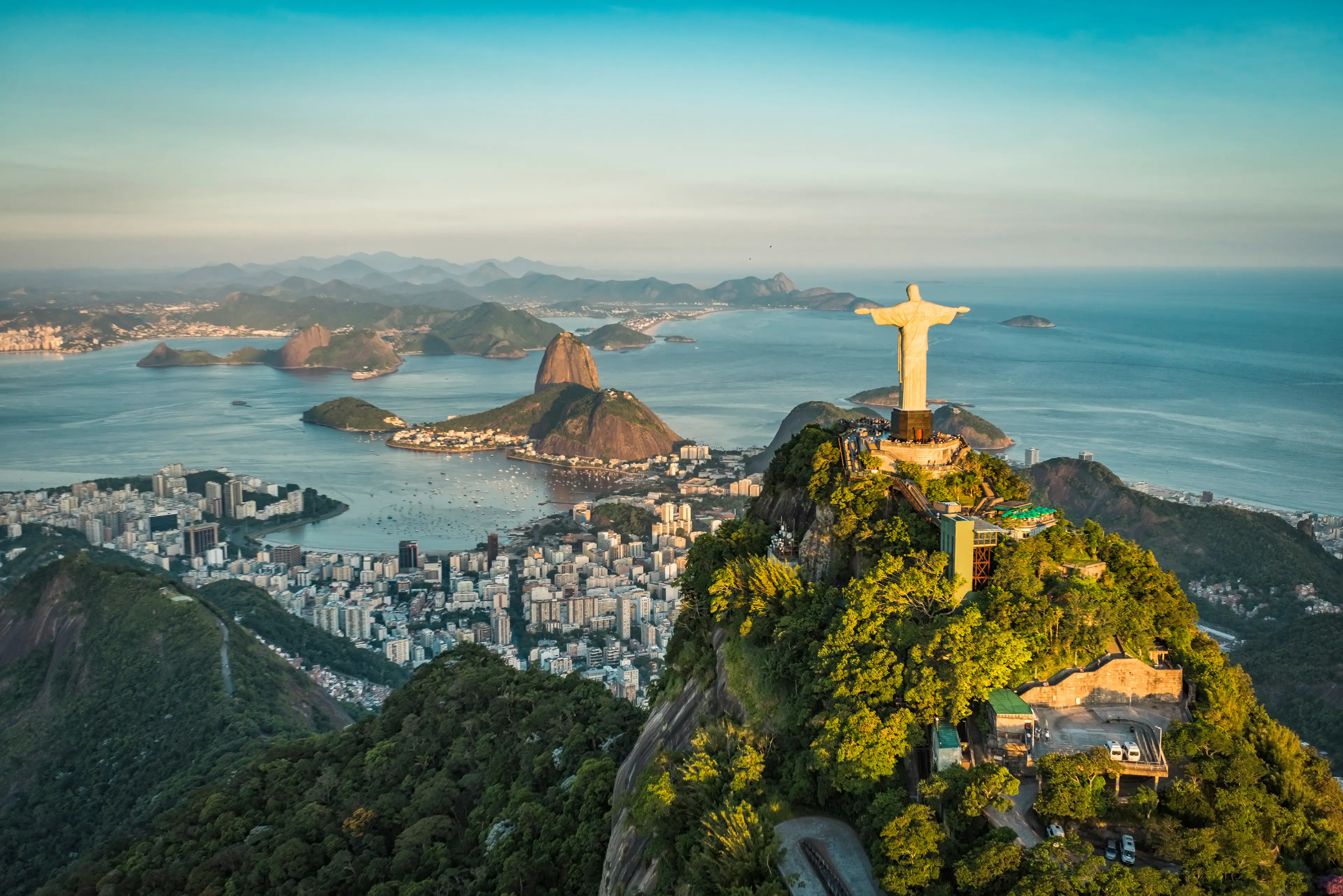 Aerial view of Christ the Redeemer and Botafogo Bay in Rio de Janeiro from a high angle.