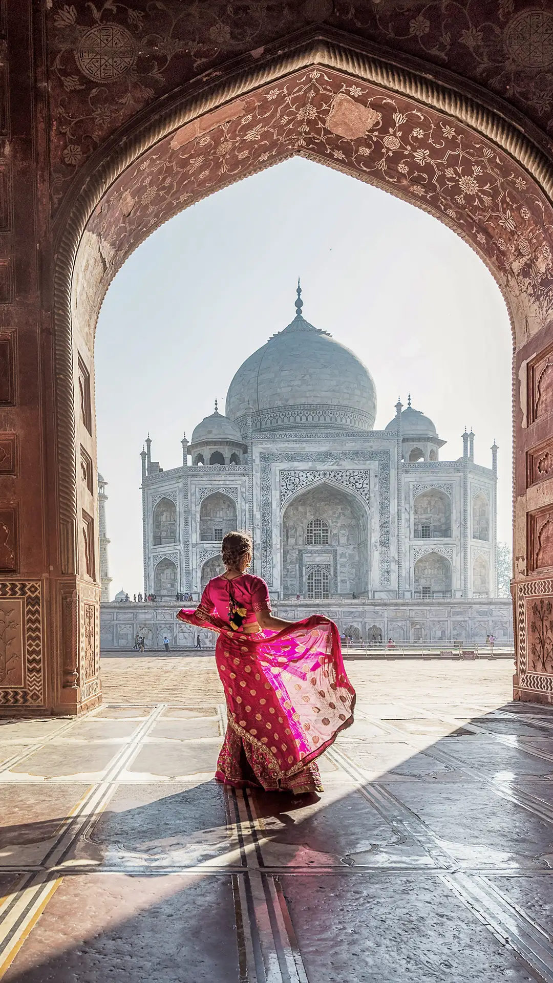 Woman in sari at Taj Mahal.