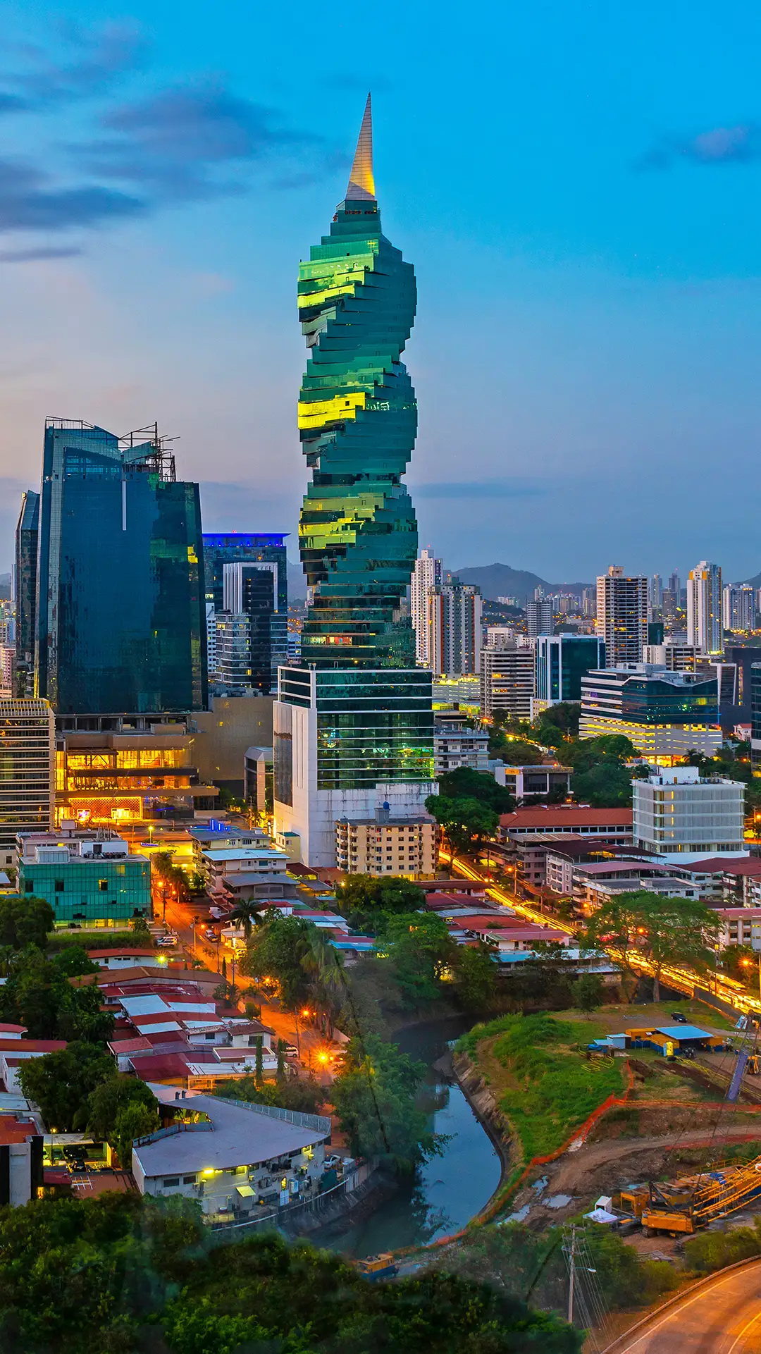 Colourful panoramic skyline of Panama City at sunset with high rise skyscrapers.