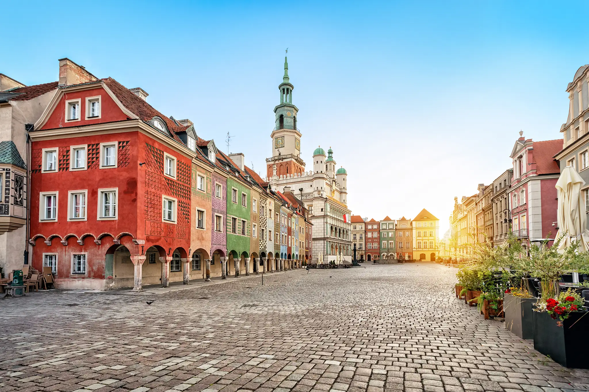 Stary Rynek square with small colorful houses and old Town Hall in Poznan, Poland.