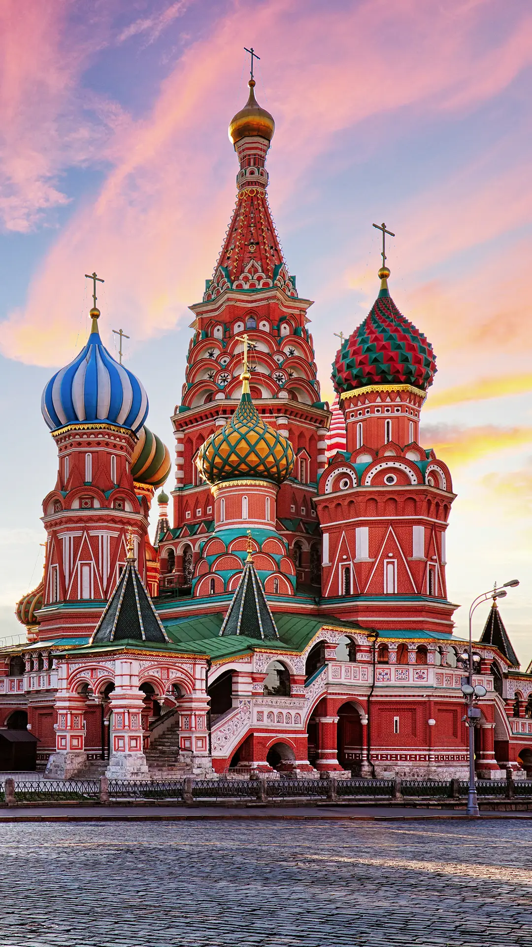 Red square view of St. Basil's Cathedral at sunrise.