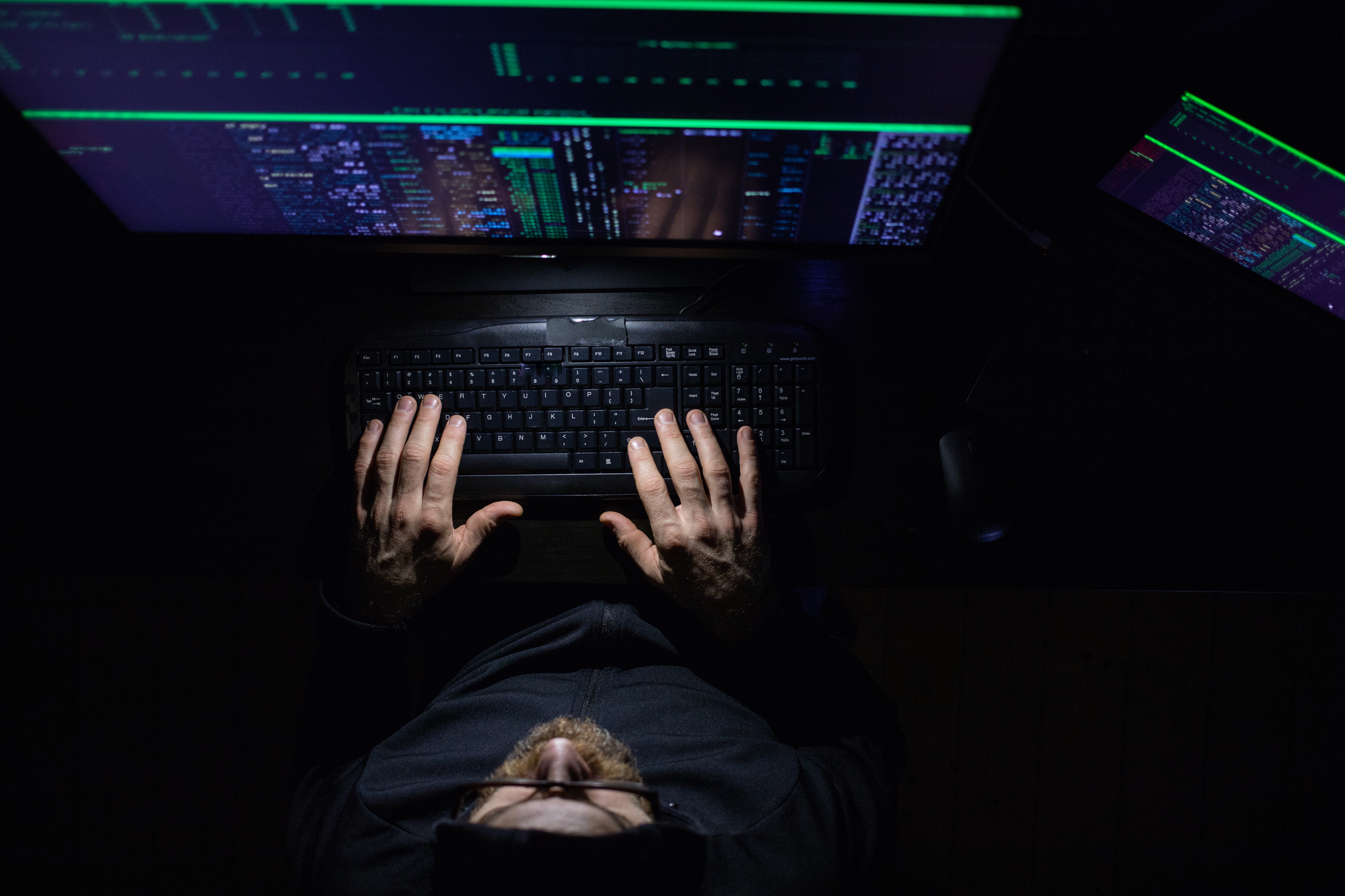 hacker coding at night cybersecurity concept