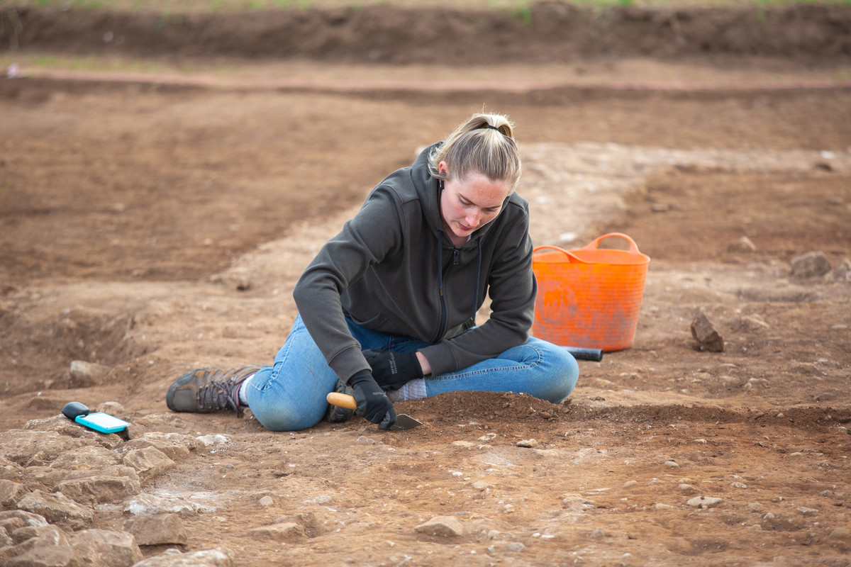 A student taking part in a Roman Villa excavation