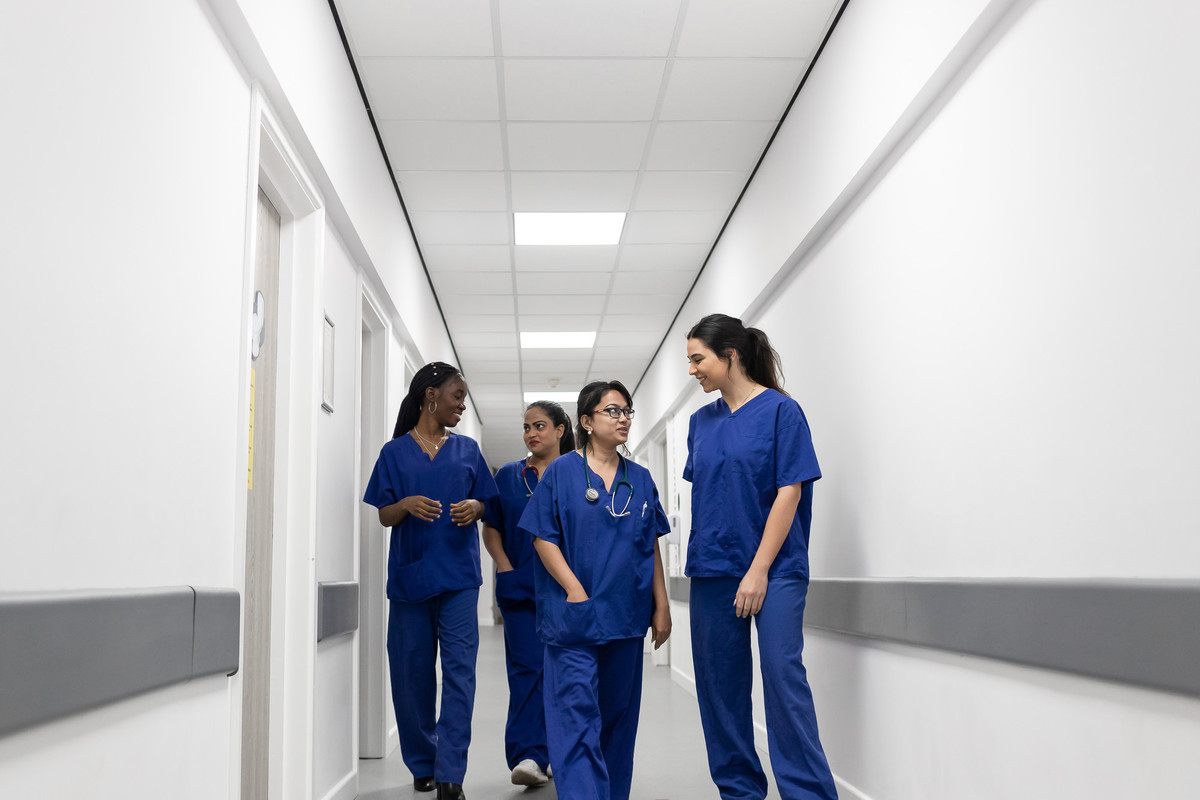 nursing students talking in corridor