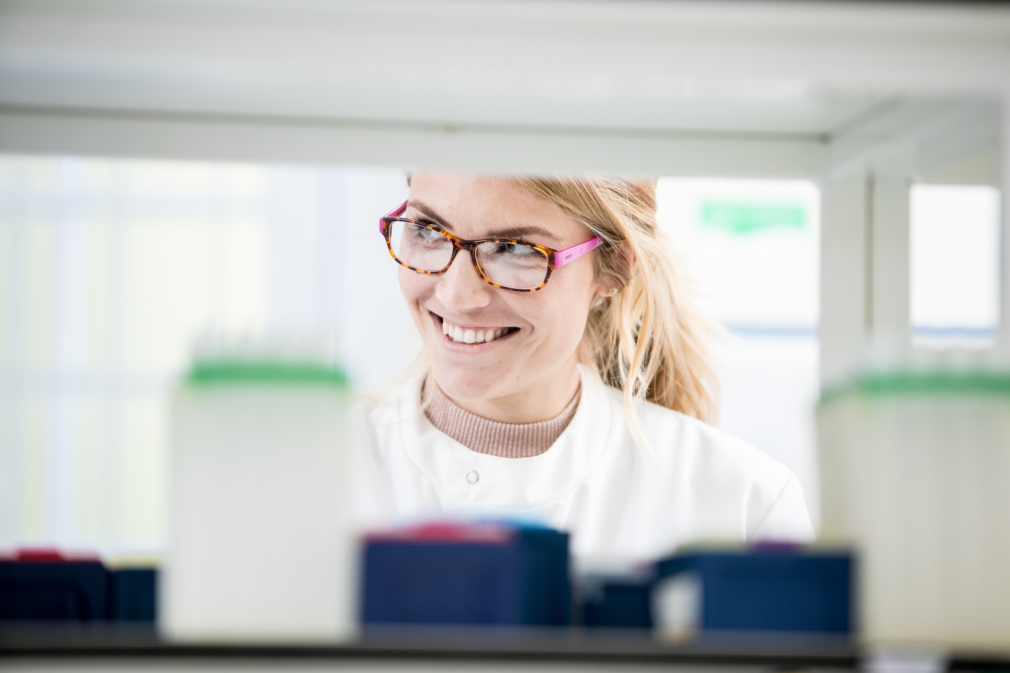 Woman in white coat in a lab