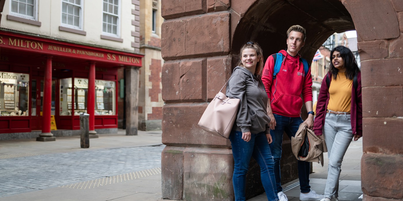 Three students hanging out in Chester city centre