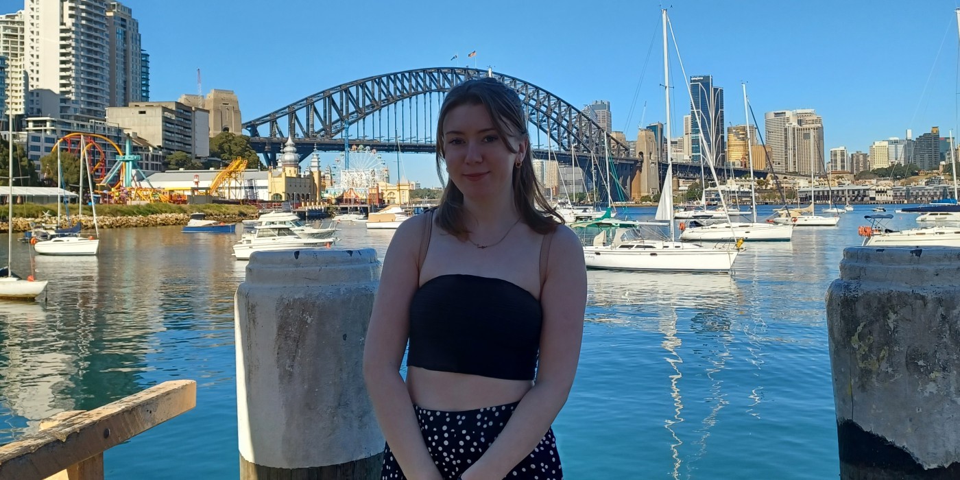 International Tourism Management student standing in front of Sydney Harbour bridge