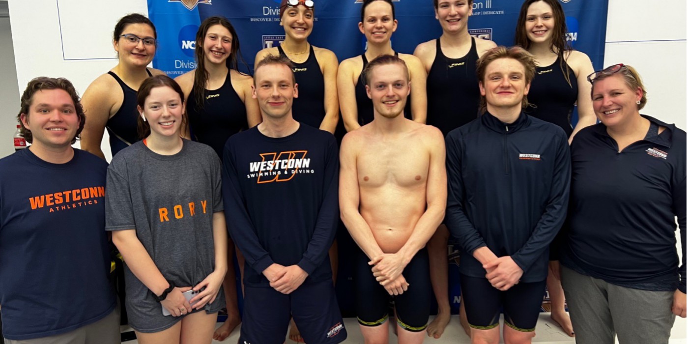 A swimming team pose for a photo