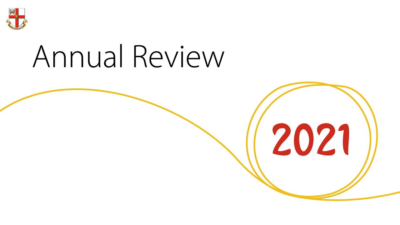 Text reading Annual Review 2021 with a yellow thread running through